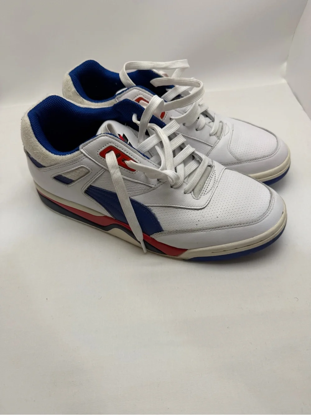 Puma White Athletic Sneakers with Blue and Red Accents